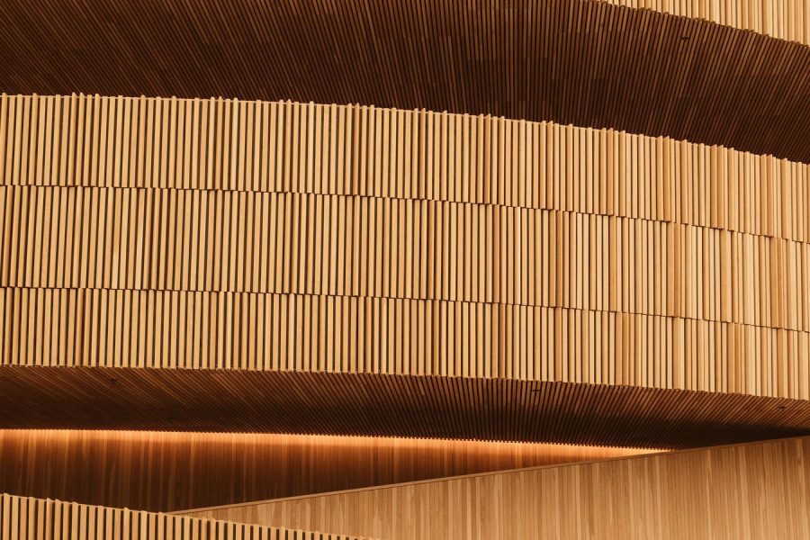 Perforated acoustic panelling with mineral wool visible behind the holes