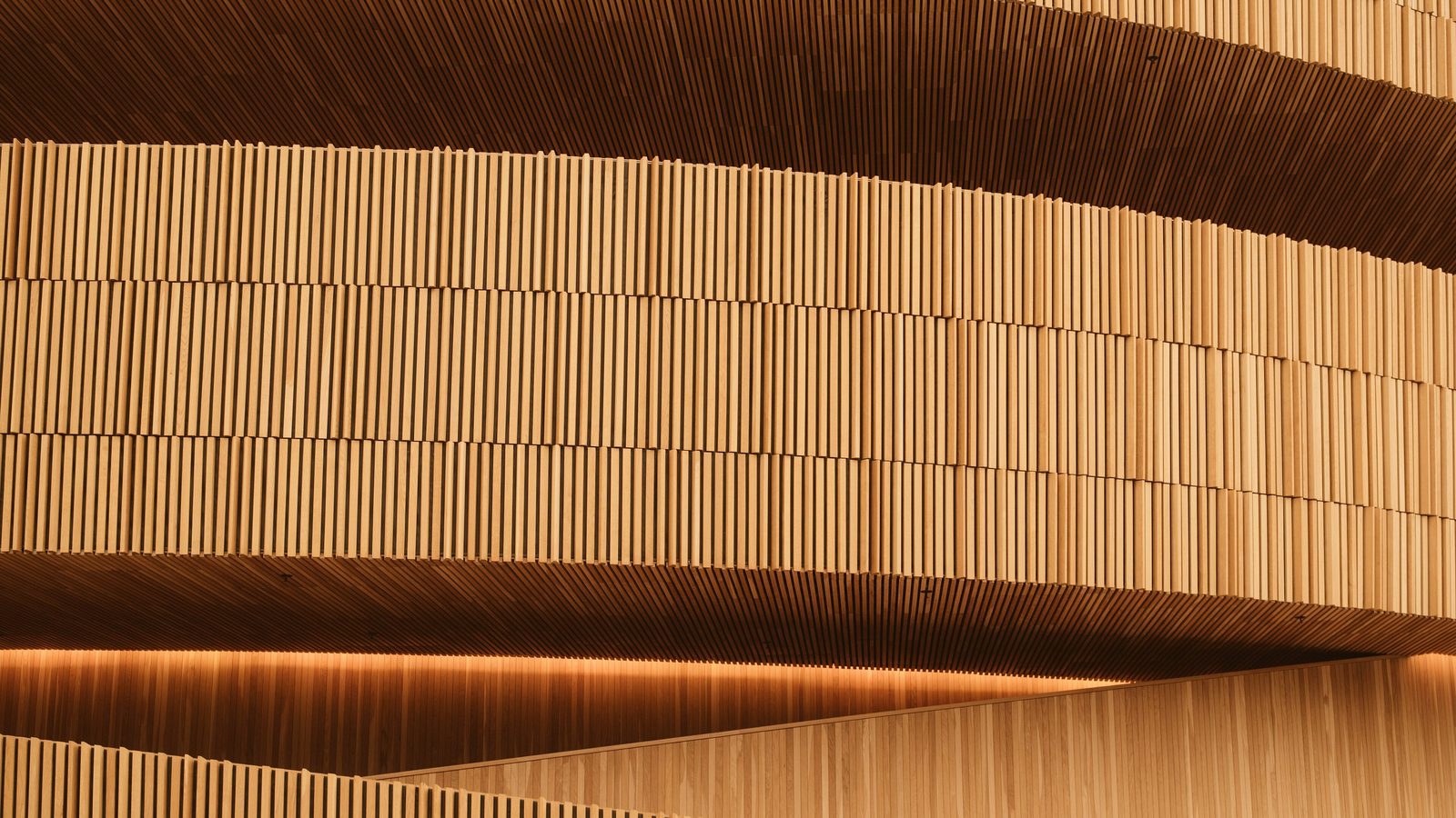Perforated acoustic panelling with mineral wool visible behind the holes