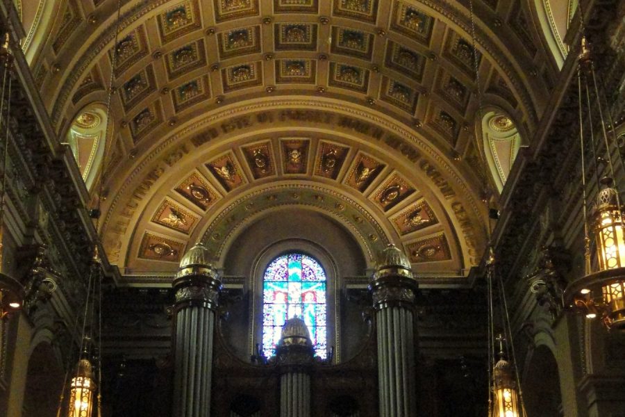 The stone nave of a church looking towards the chancel