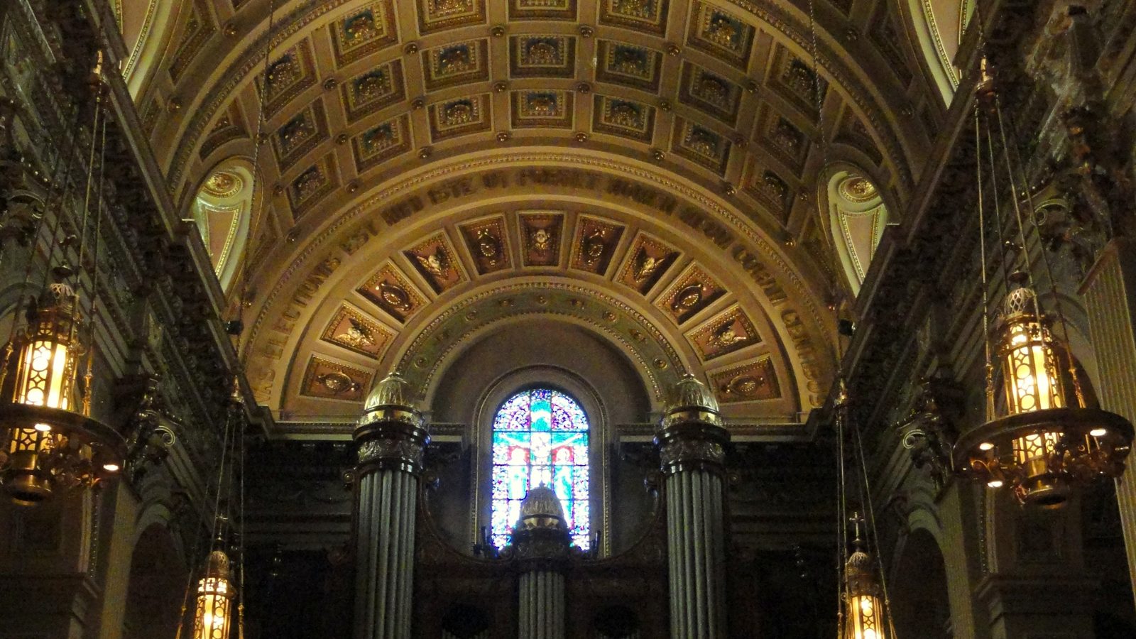 The stone nave of a church looking towards the chancel